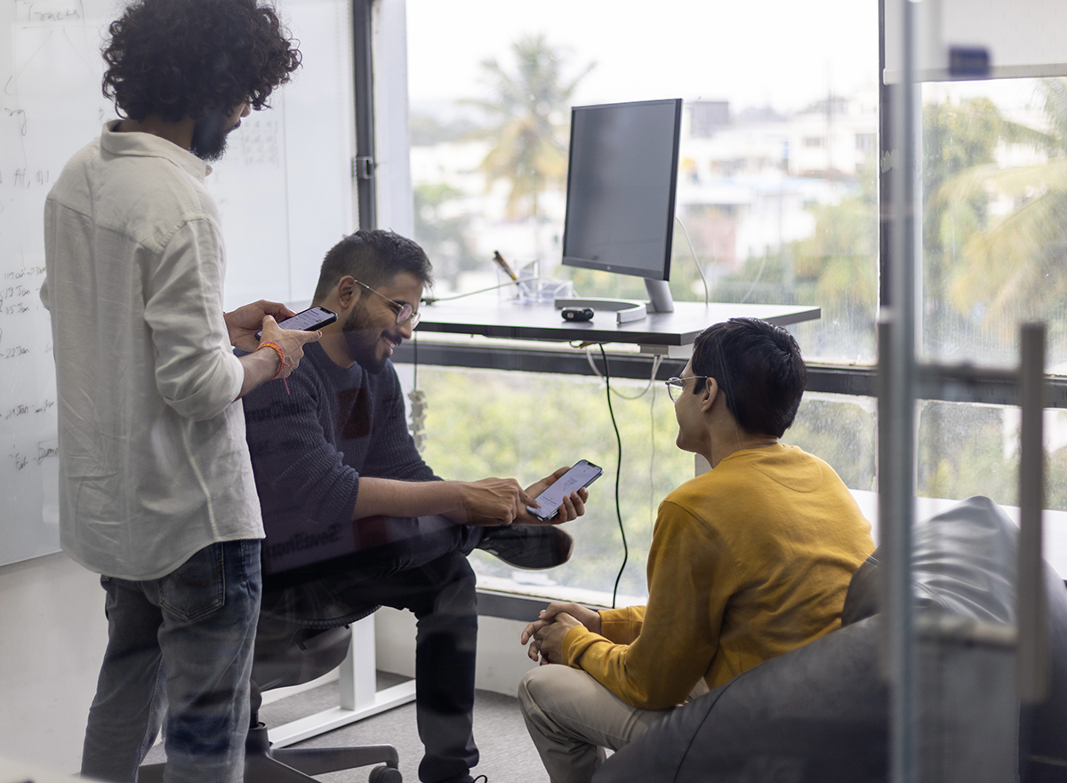 Fold team member sitting in meeting room discussing and smiling